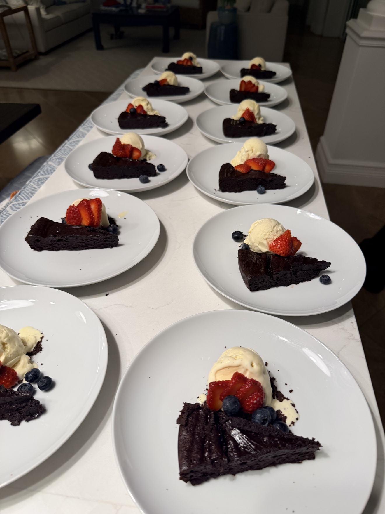 Flourless chocolate torte with vanilla ice cream and berries