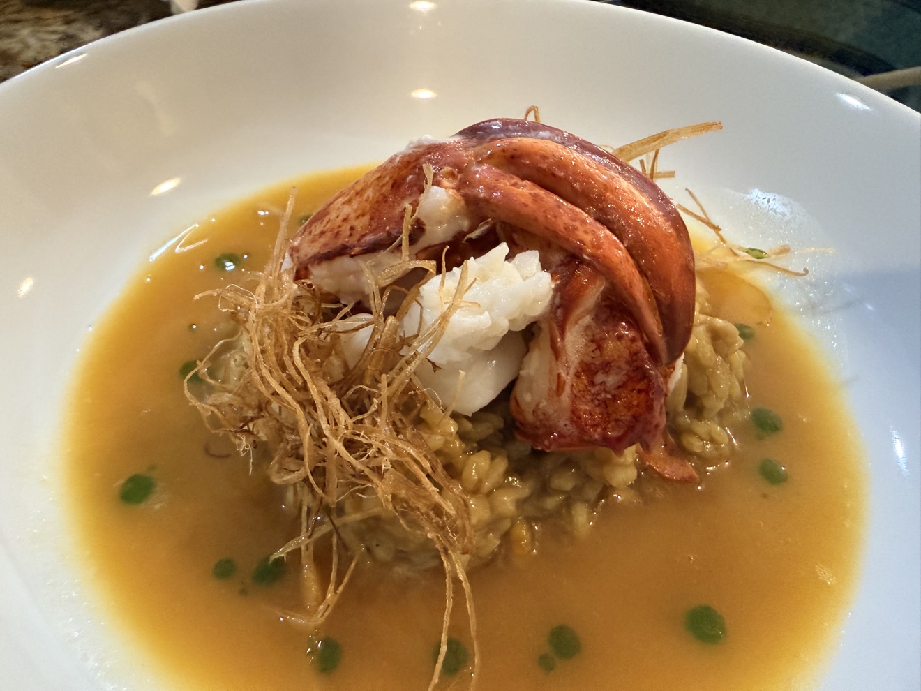 Lobster risotto plated for dinner service