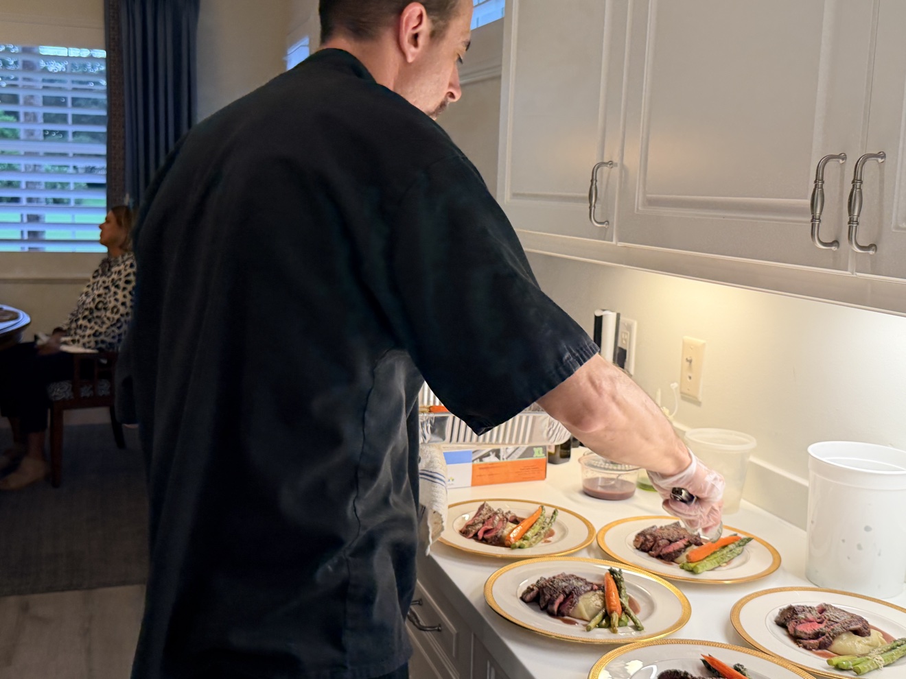 Chef Tony plating in a client's kitchen