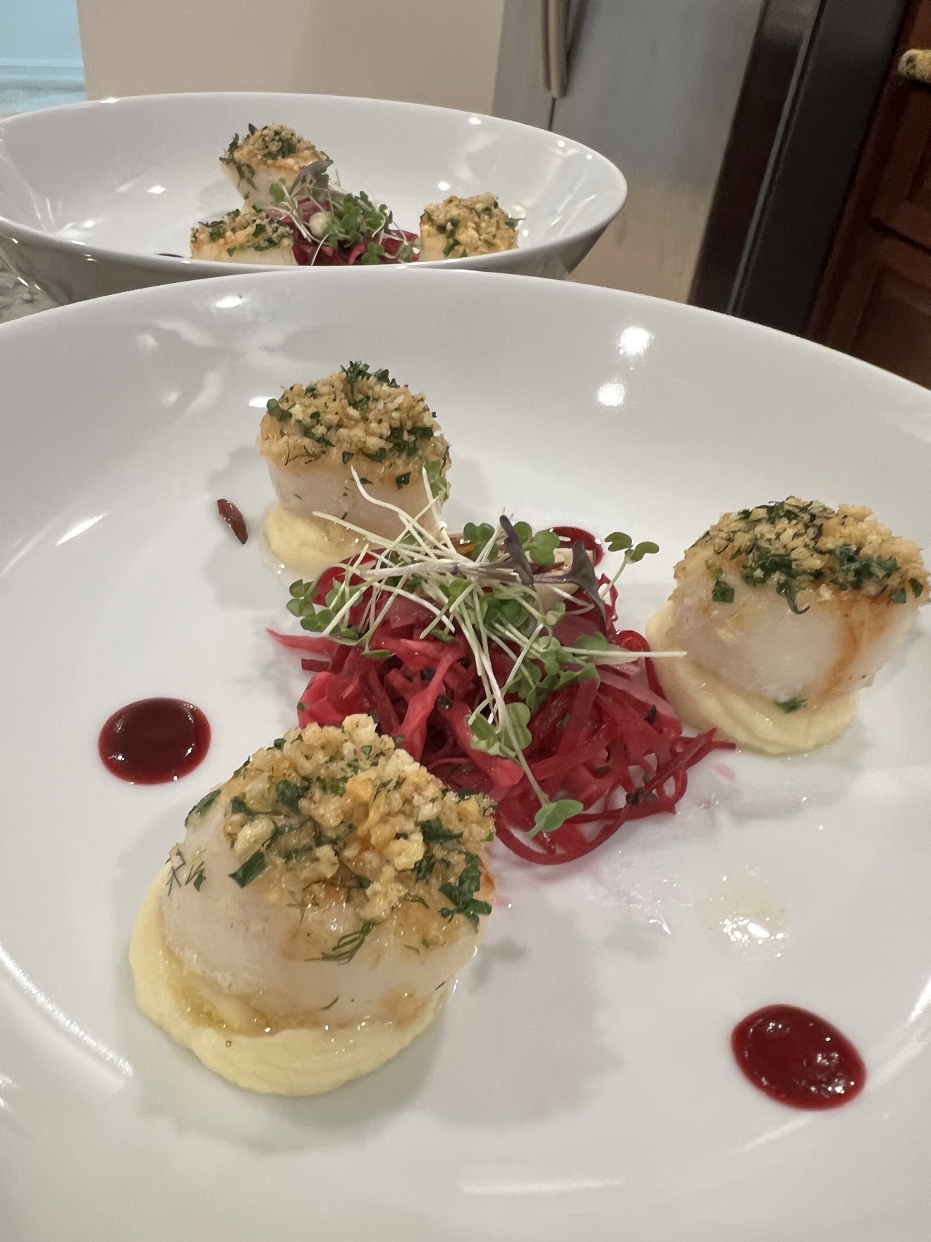 Herb-crusted seared scallops with pickled beet slaw and microgreens