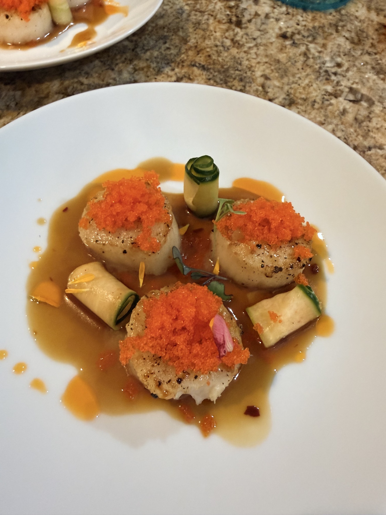 Seared scallops with tobiko and cucumber